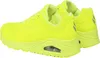 A pair of bright yellow Skechers sports shoes are shown from a side angle against a white background. Voir les images du produit