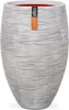 A tall, textured planter pot with a label attached. Voir les images du produit