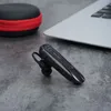 A Bluetooth headset, its charging case, and a laptop are arranged on a textured gray surface. Náhled obrázku produktu