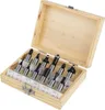 A set of router bits in a wooden box. Voir les images du produit
