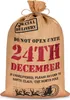 A burlap sack with Christmas-themed text and graphics. Produktbild-Vorschau