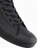 A close-up view of the toe and laces of a black sneaker. Anteprima dell’immagine prodotto