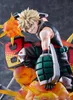 A close-up of a detailed anime action figure of Katsuki Bakugo from My Hero Academia, in a dynamic pose with fiery effects. Produktbild-Vorschau