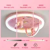 A ceiling light fixture with a pink cartoon design, showing different light color temperatures and brightness levels. Produktbild-Vorschau