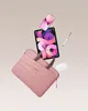 A collection of electronic devices and a laptop bag floating against a plain background. Produktbild-Vorschau