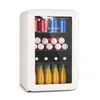 A white mini-refrigerator filled with drinks, including cans and bottles of juice, against a white background. Náhľad obrázku produktu