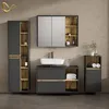 A modern bathroom vanity set with a sink, mirror, and storage cabinets. Voir les images du produit