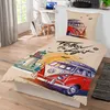 A bedding set with a VW van and lighthouse design is displayed on a bed. Náhled obrázku produktu
