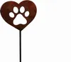 A garden stake in the shape of a heart with a paw print cut-out, made of rusted metal. Produktbild-Vorschau