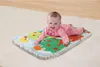 A baby is lying on a colorful play mat on the floor. Produktbild-Vorschau