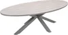 An oval outdoor dining table with a light teak Vironwood tabletop and a taupe metal base, shown against a white background. Produktbild-Vorschau