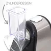 Close-up of the top part of an electric grater, showing the transparent cylinder attachment and a button on the main body. Anteprima dell’immagine prodotto