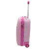 A pink children's suitcase with a retractable handle and wheels, shown from the side against a white background. Podgląd zdjęcia produktu