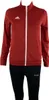 A studio shot of a red Adidas jacket and black Jako pants on a mannequin. Voir les images du produit