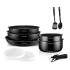 A set of cookware and utensils arranged on a white background. Voir les images du produit