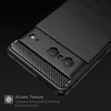 Close-up of the back of a black phone case with carbon fiber accents. Náhled obrázku produktu