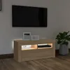 A modern living room setup with a TV mounted on the wall above a TV stand. Voir les images du produit
