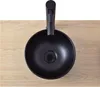 A black ceramic basin with a black faucet is placed on a light wooden surface. Anteprima dell’immagine prodotto