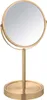 A gold-colored makeup mirror on a stand. Produktbild-Vorschau
