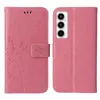 A pink floral flip phone case is shown open, displaying the inside and the phone it is designed for. Produktbild-Vorschau