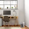 A home office setup with a desk, computer, chair, and a space heater. Anteprima dell’immagine prodotto