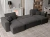 A modern U-shaped sectional sofa in an anthracite color, placed on a patterned rug in a living room setting. Voir les images du produit