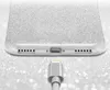 Close-up of the bottom of a glittery silver phone case with a charging cable plugged in. Produktbild-Vorschau