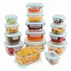 A collection of glass food storage containers filled with various food items, arranged in stacks. Podgląd zdjęcia produktu