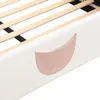 A close-up view of the side of a white bed frame with a pink pocket attached. Podgląd zdjęcia produktu