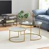 A living room scene with a sofa, TV stand, and a set of nesting coffee tables.