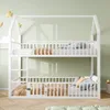 A white bunk bed with a house-like frame, set against a light green wall and wooden floor. Pillows and blankets are visible on both beds. Anteprima dell’immagine prodotto