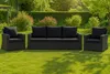 Outdoor furniture set on a green lawn with lush green bushes and trees in the background. Anteprima dell’immagine prodotto