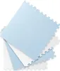 Several interlocking foam puzzle mats are stacked and fanned out on a white background. Anteprima dell’immagine prodotto