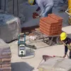 Construction site with workers, bricks, and equipment. Anteprima dell’immagine prodotto
