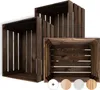 Three wooden crates of varying sizes are arranged in a staggered formation against a white background. Produktbild-Vorschau