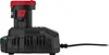 A black and red battery charger with a battery inserted, plugged into a power source, shown from the side against a white background. Podgląd zdjęcia produktu