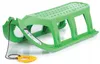 A green plastic sled with a yellow handle and rope, shown on a white background. Produktbild-Vorschau