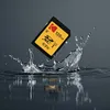 A Kodak SD card is shown suspended above a splash of water. Produktbild-Vorschau