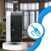 Side view of a portable radio on a white pedestal, with a blurred background of a room. A blue circular overlay with a jack plug icon is present. Voir les images du produit