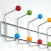 A close-up shot of a multi-colored hook rack mounted on a white wall. Náhľad obrázku produktu