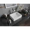 A modern bathroom vanity with a vessel sink, faucet, and various decorative items. Podgląd zdjęcia produktu