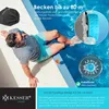 A man relaxing by a pool with a pool robot nearby. Produktbild-Vorschau