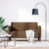 A brown loveseat sofa is shown in a minimalist room setting with a floor lamp and a coffee table. Voir les images du produit