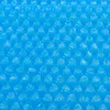 A close-up, abstract view of a blue solar pool cover with a bubble pattern. Produktbild-Vorschau