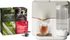 A tea maker with a glass of tea and boxes of tea. Produktbild-Vorschau