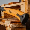 A close-up shot of an axe handle resting on wooden pallets. Náhled obrázku produktu
