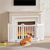 A white wooden pet gate is set up in front of a fireplace, with a corgi dog sitting in front of it. Podgląd zdjęcia produktu