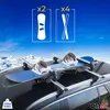 A car roof rack with a snowboard and bindings attached, set against a backdrop of snowy mountains and a blue sky. Podgląd zdjęcia produktu