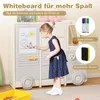 A young girl is drawing on a whiteboard attached to a toy storage unit designed to look like a bus. Náhľad obrázku produktu