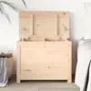 A wooden chest with its lid open, placed next to a bed and a basket of laundry. Podgląd zdjęcia produktu